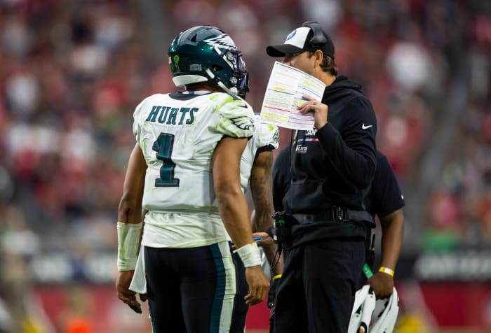 Oct 9, 2022; Glendale, Arizona, USA; Philadelphia Eagles quarterback Jalen Hurts (1) talks with offensive coordinator Shane Steichen against the Arizona Cardinals at State Farm Stadium. Mandatory Credit: Mark J. Rebilas-USA TODAY Sports